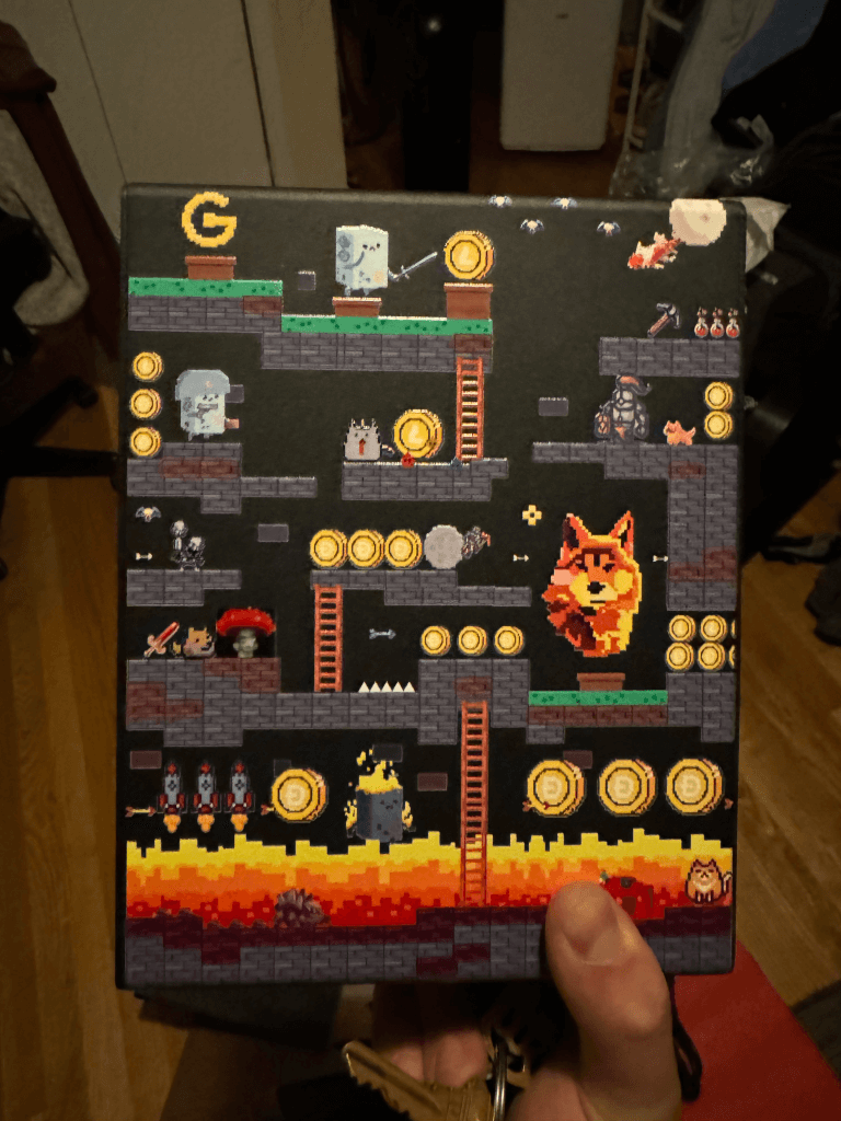 a hand holding a video game board